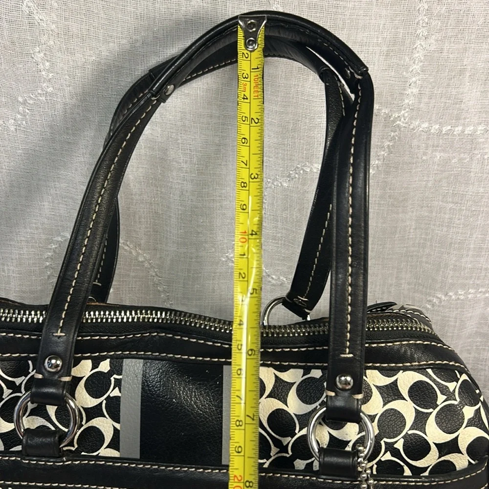 Coach boston leather travel bag with a tag
